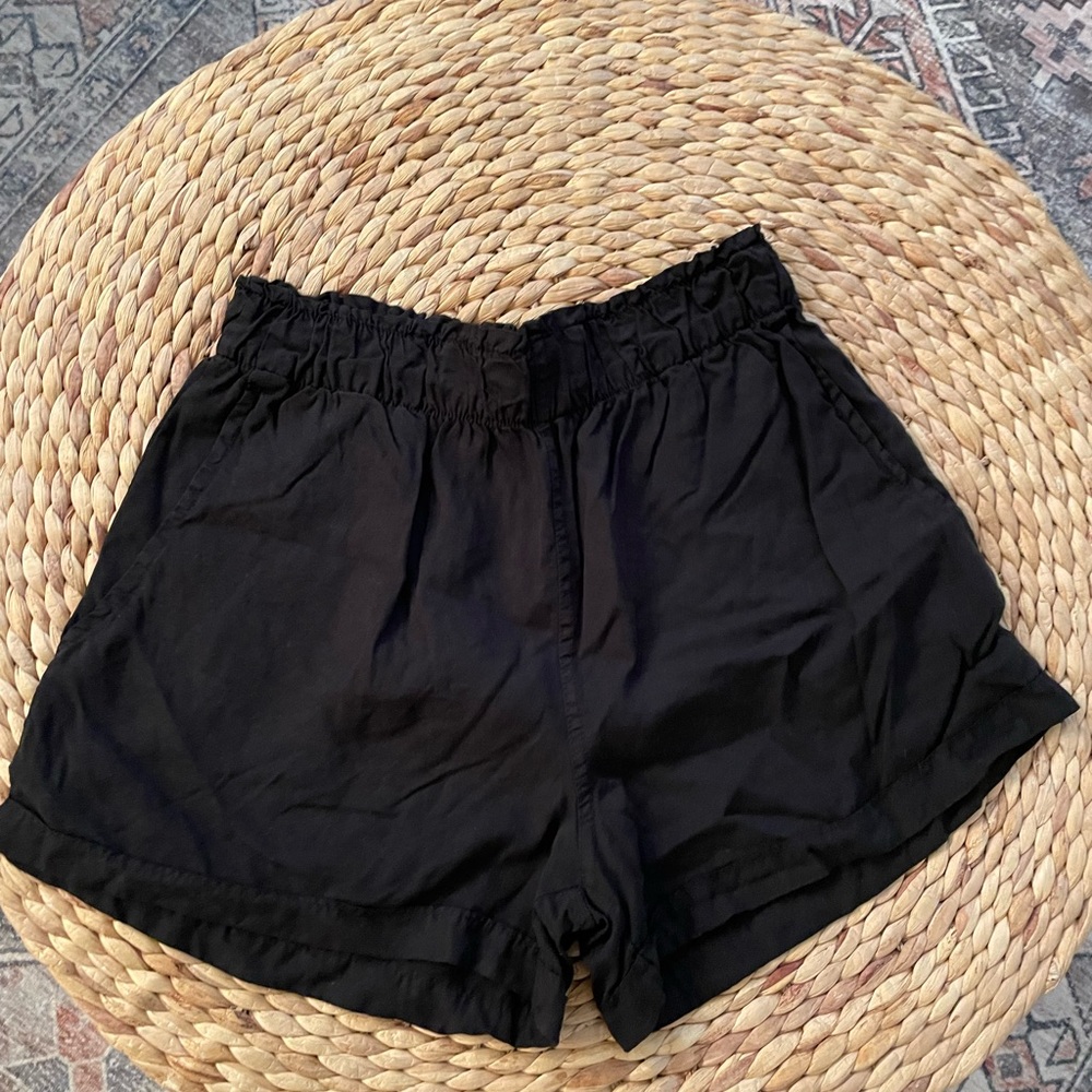 Altar’d State black shorts. Fits small. I typically wear a small/medium.